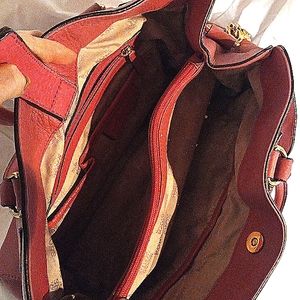 Lightly  used pink Michael kors snap close two handles and one shoulder strap,